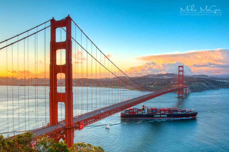 Cargo Ship Heading Out to the Pacific Ocean under Golden Gate Bridge