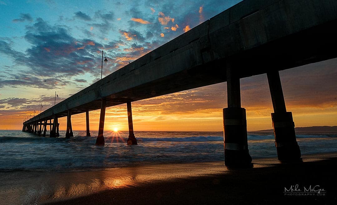 Sunset under the pier in Pacifica, California